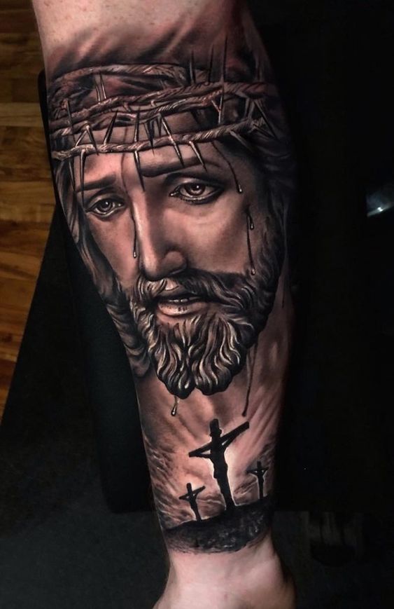 img/arm-tattoo-jesus-am-kreuz.jpg